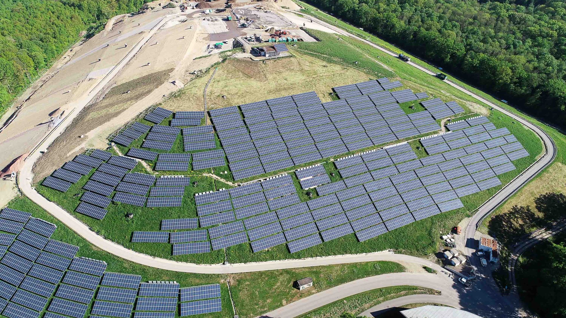 A hill covered in solar panels.