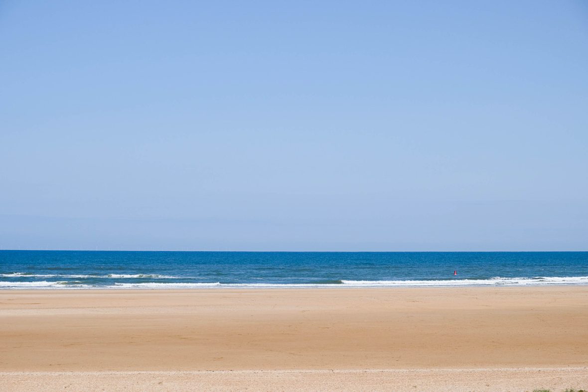 White sand and blue water.