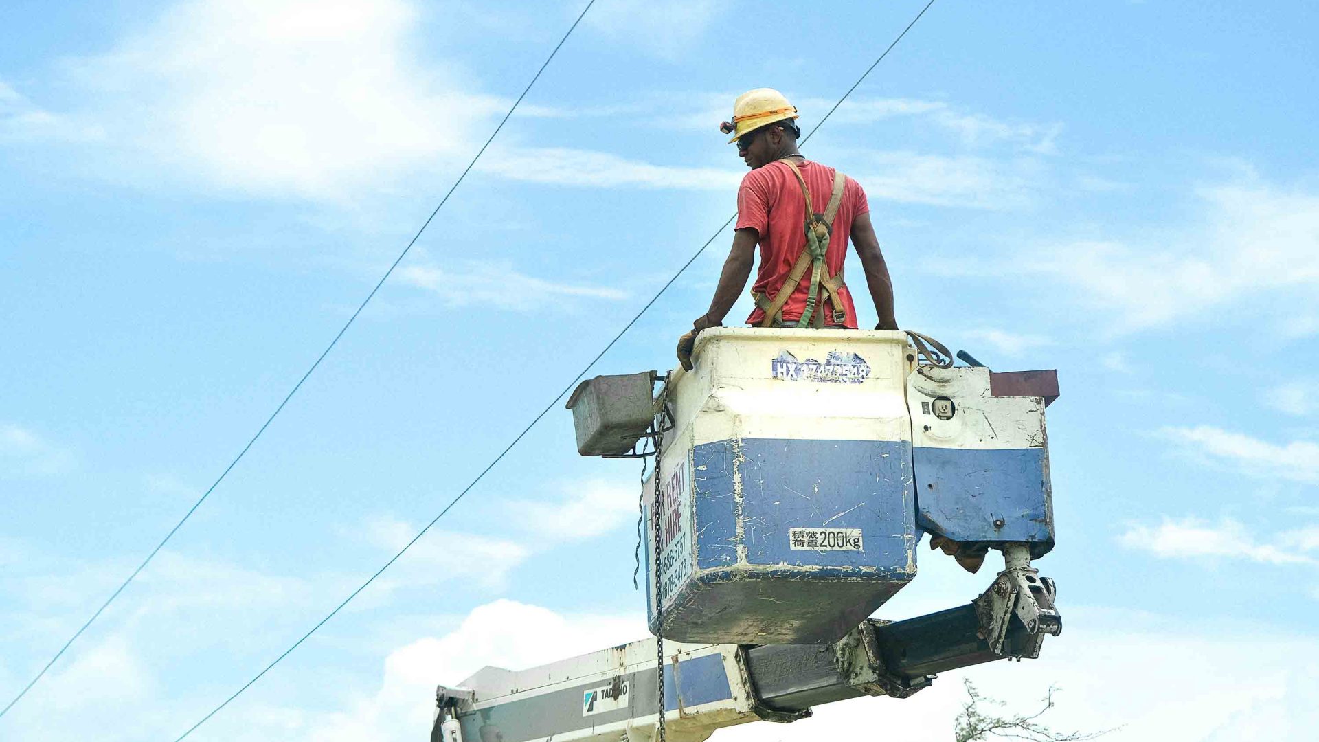 A person fixes a power line.